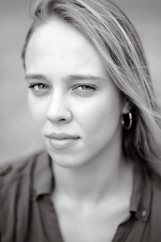 A black and white headshot of a young woman captured by Sarah Anne Wilson Photography in Cary, North Carolina.