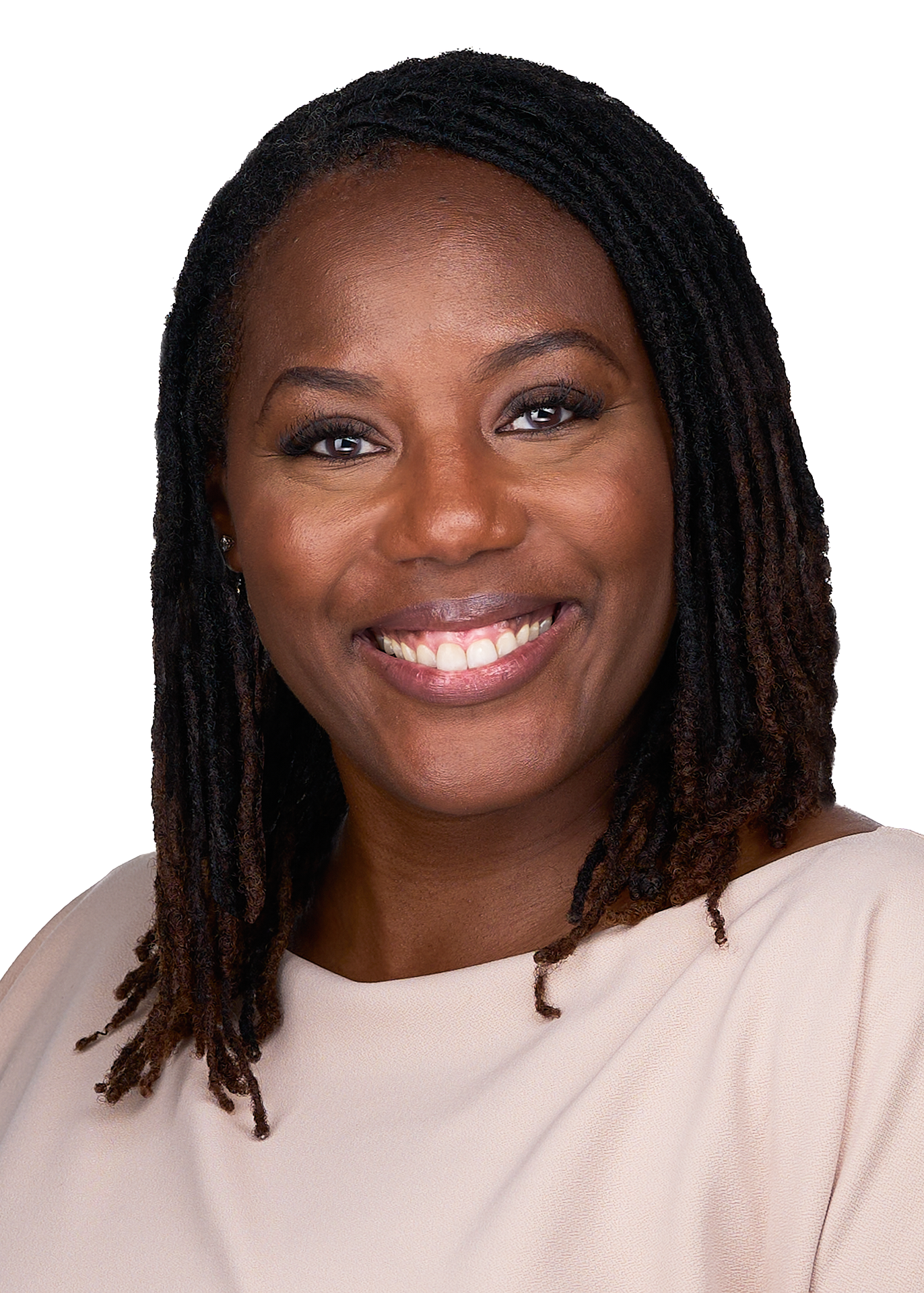 A young African American woman smiles for a professional corporate headshot wearing a beige blouse.