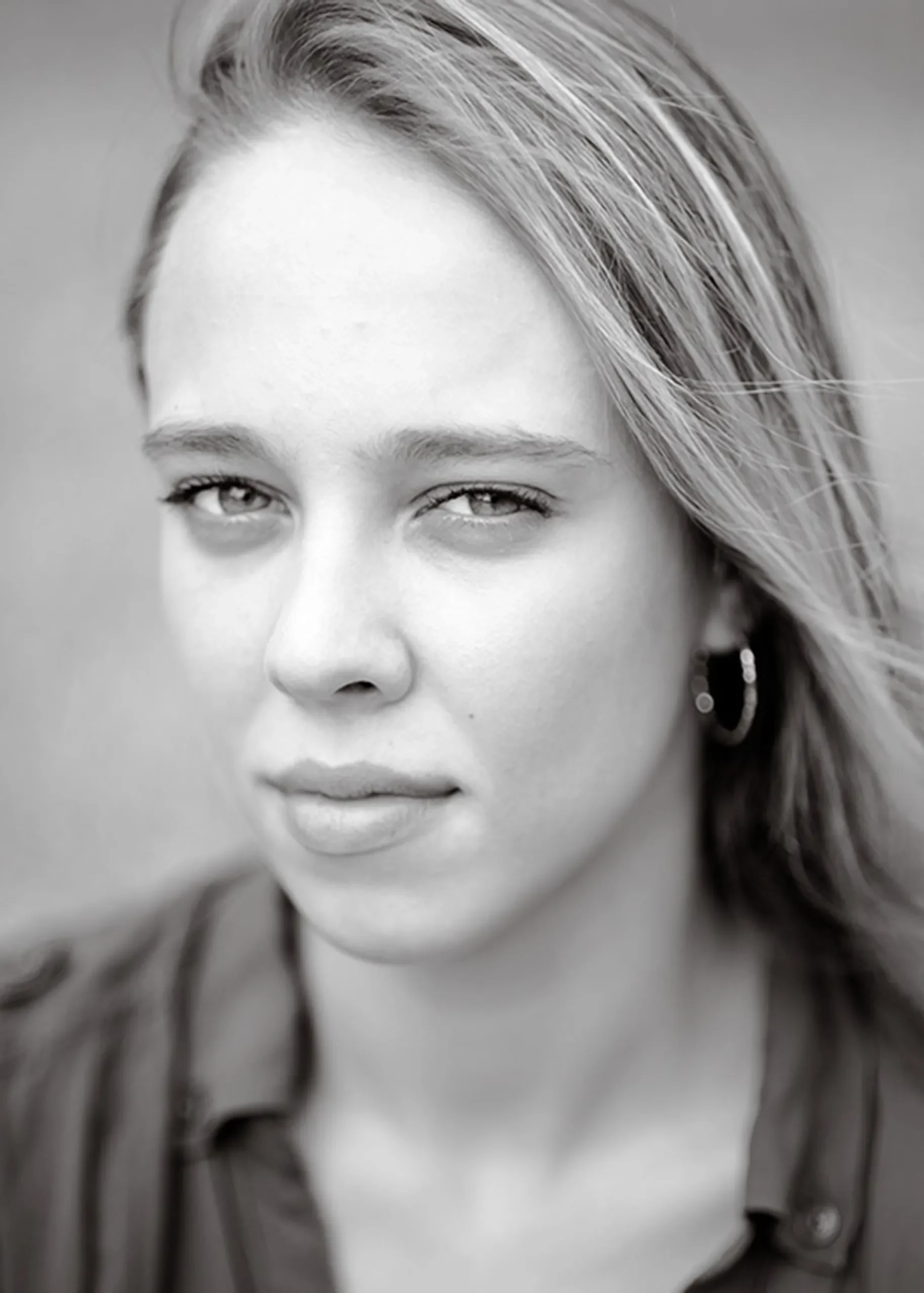 A black and white headshot of a young woman captured by Sarah Anne Wilson Photography in Cary, North Carolina.